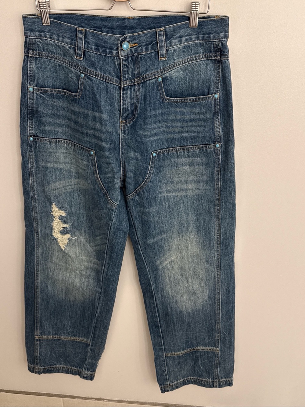 Turquoise buttons 
Relaxed Fit Distressed Jeans